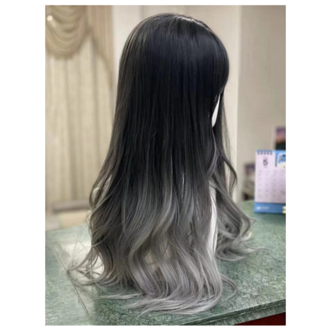 A long wavy wig with black and grey hair color